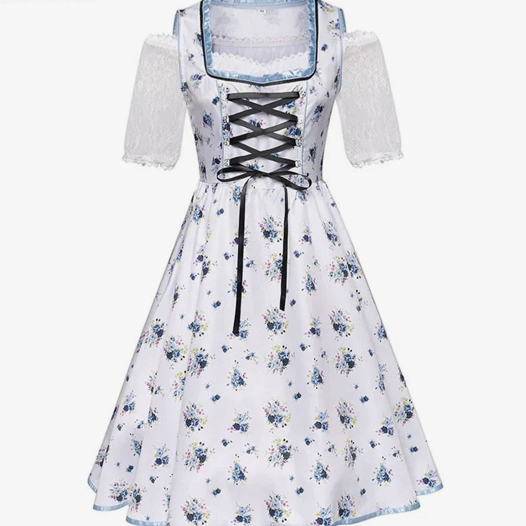 Weißes Dirndlkleid mit blauem Blumenmuster und schwarzer Schnürung vorne