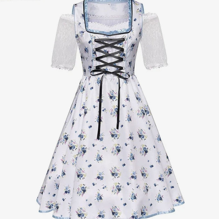 Weißes Dirndlkleid mit blauem Blumenmuster und schwarzer Schnürung vorne