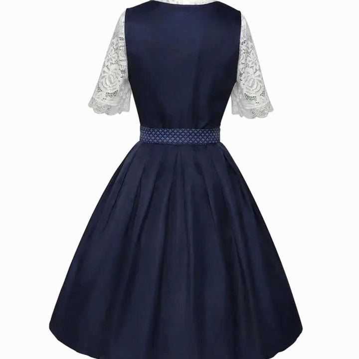 Dunkelblaues Dirndl-Kleid mit Spitzenbluse, Rückansicht mit gemustertem Taillenband