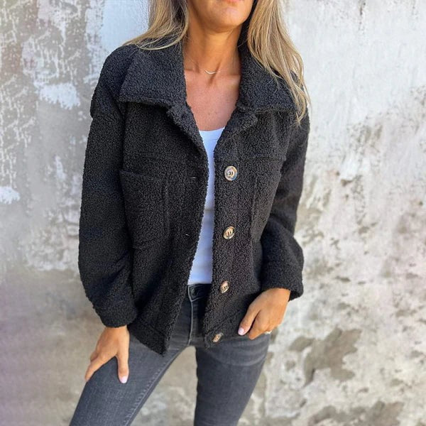 Schwarze kurze Wolljacke mit Reverskragen und aufgesetzten Taschen