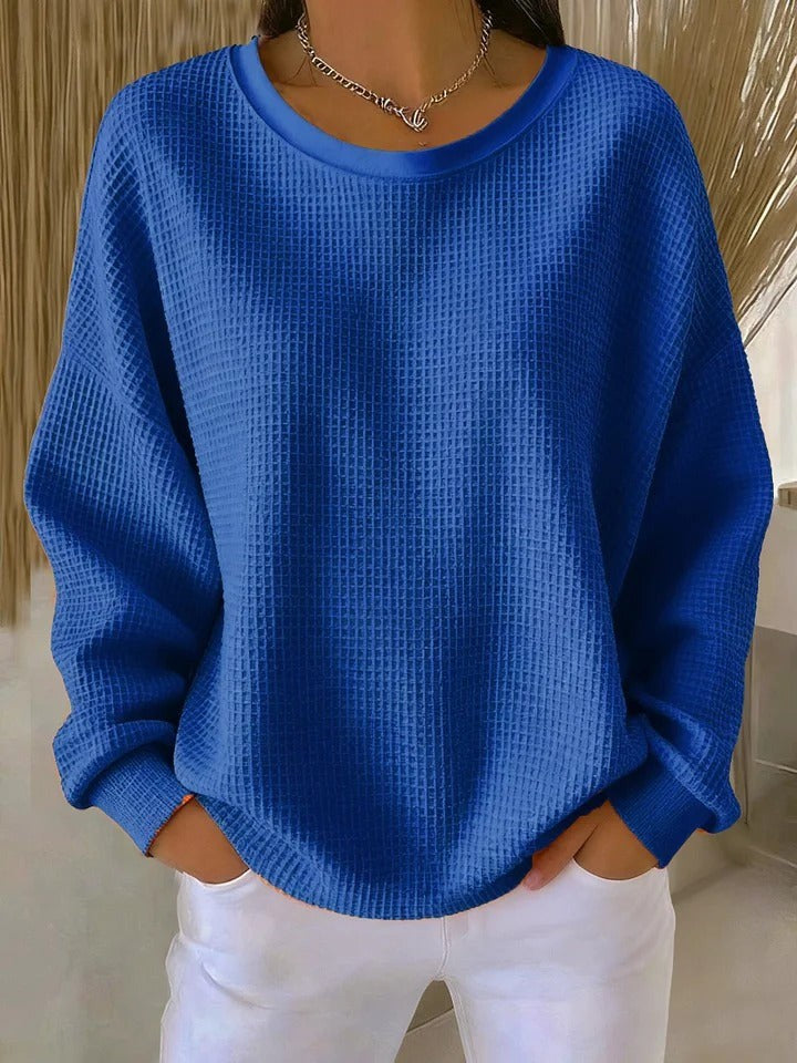 Blauer Waffelstrick-Pullover mit fallenden Ärmeln und rundem Halsausschnitt