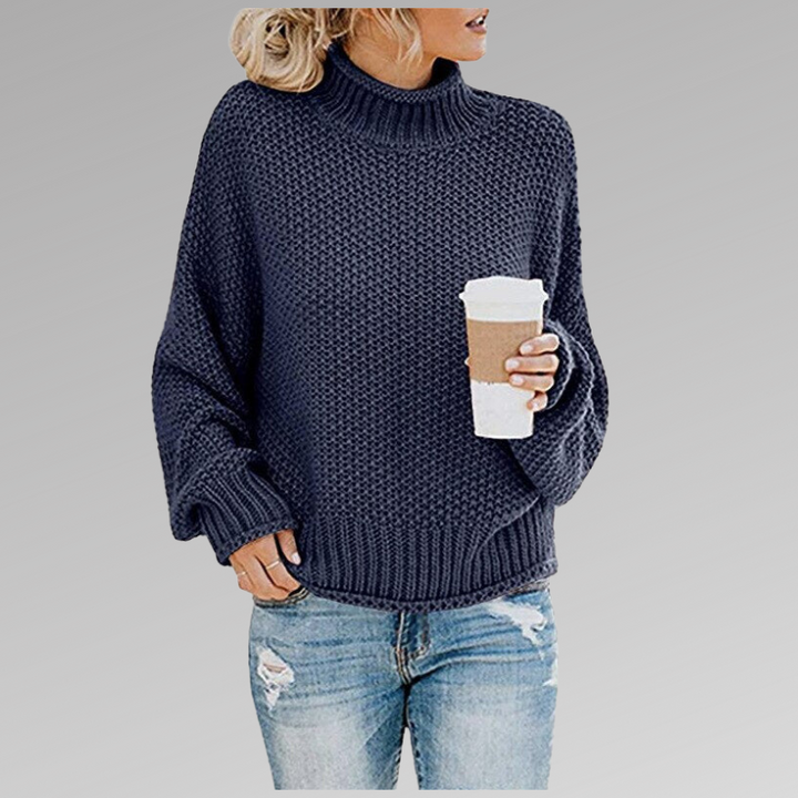 Dunkelblauer Strickpullover mit Rollkragen und grobem Strickmuster