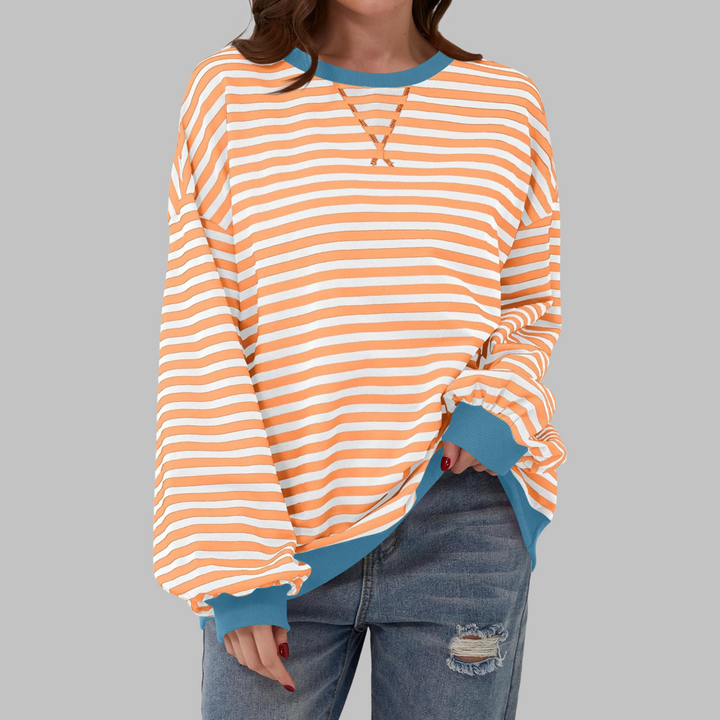 Oversize-Sweatshirt mit orange-weißem Streifenmuster und blauem Kontrastbund