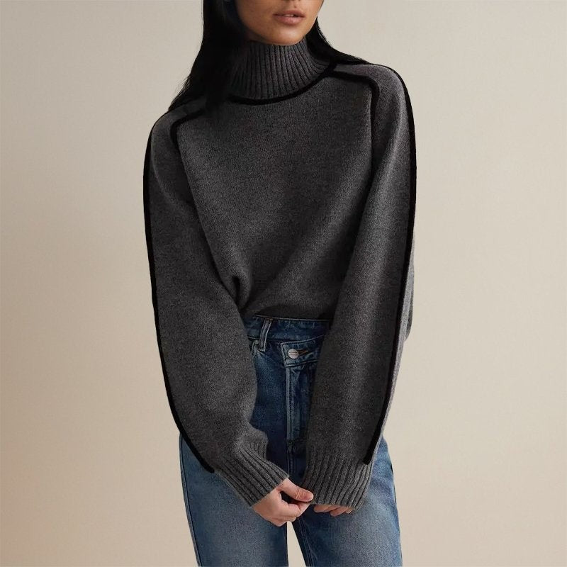 Dunkelgrauer Strickpullover mit Rollkragen und schwarzer Kontrastnaht am Arm