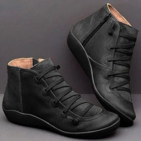 Schwarze Leder-Stiefelette mit Kreuzschnürung und seitlichem Reißverschluss