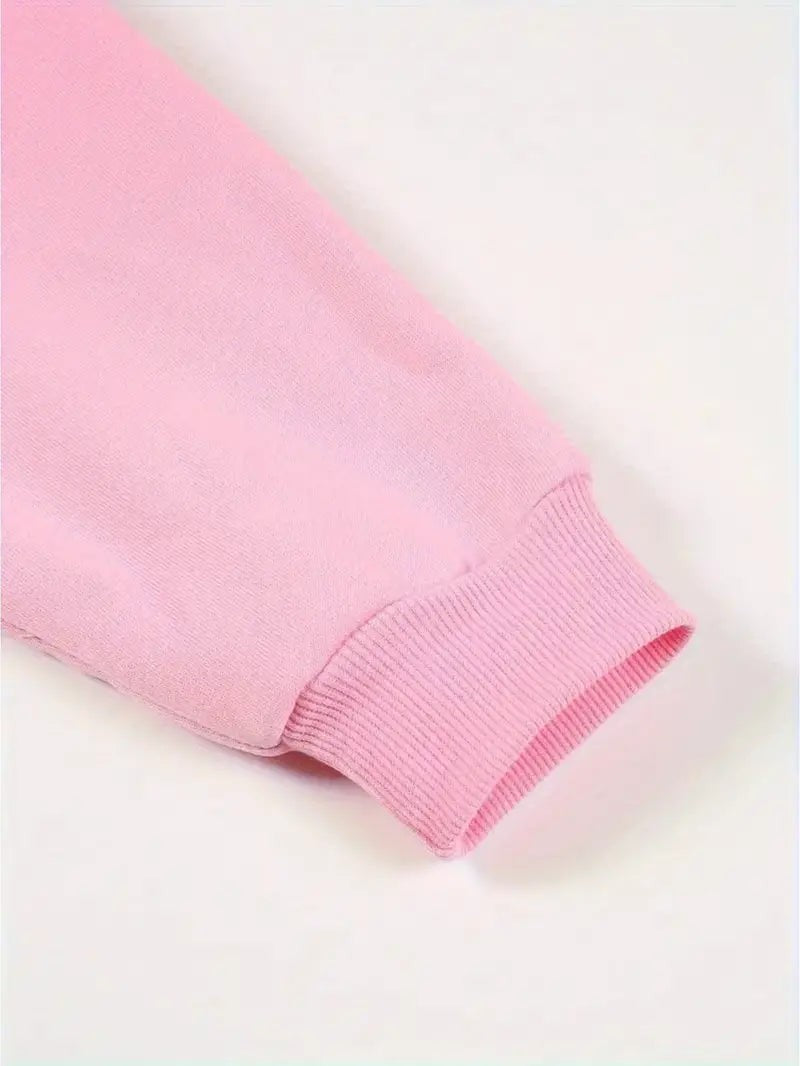 Nahaufnahme des elastischen Ärmelabschlusses am rosa Sweatshirt