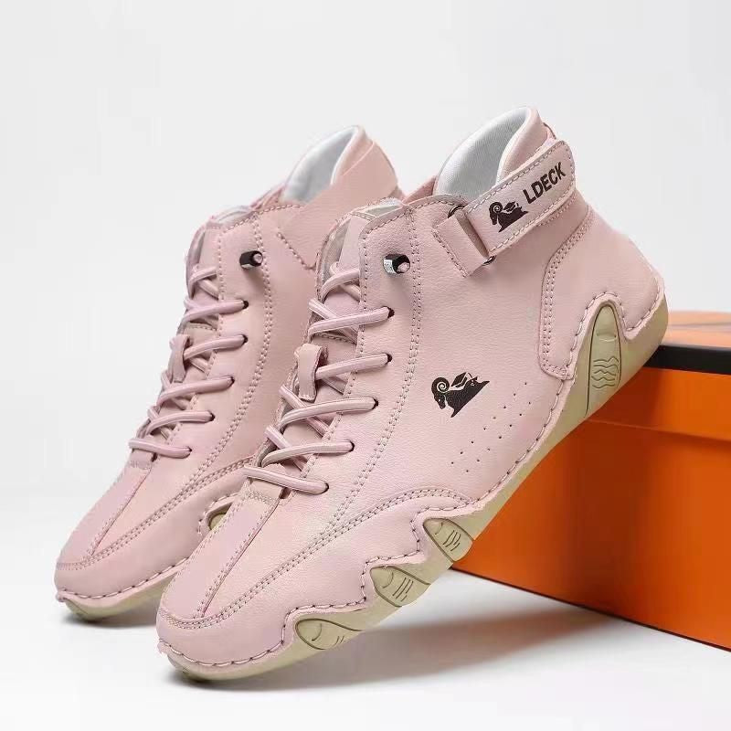 Rosa Damen-Barfußschuhe mit heller Sohle und Klettverschluss vor Schuhkarton