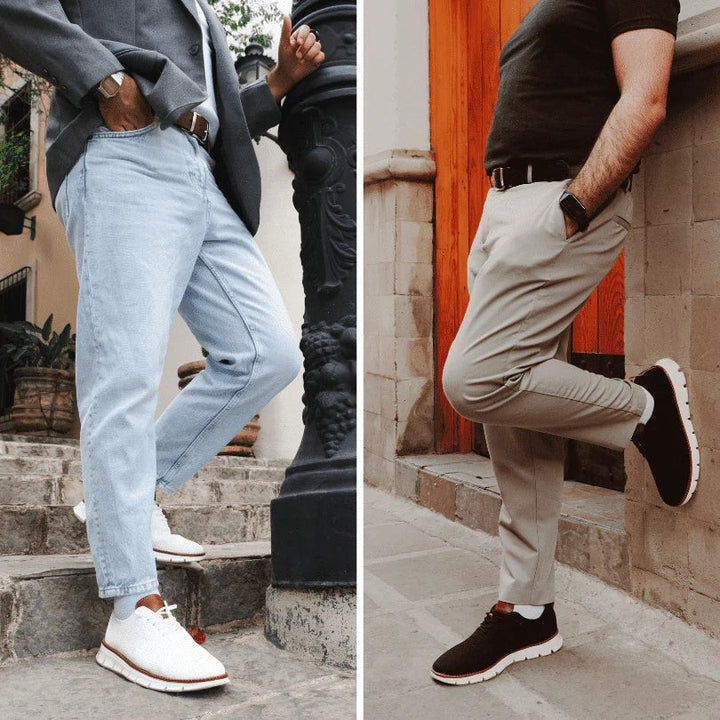 Kombination aus weißem und dunklem Sneaker zu legerer Herrenmode getragen