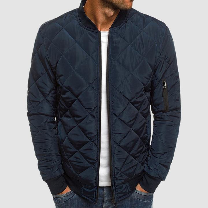 Dunkelblaue gesteppte Herrenjacke mit Ärmeltasche und Stehkragen