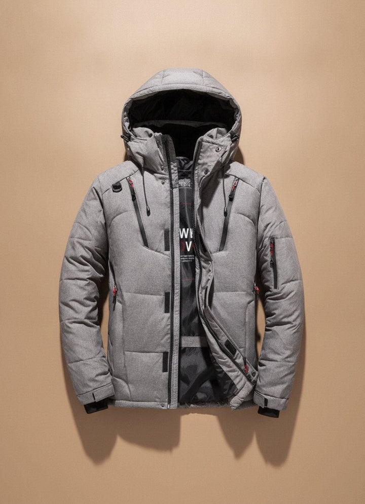 Graue Winterjacke mit gefütterter Kapuze und praktischen Brusttaschen