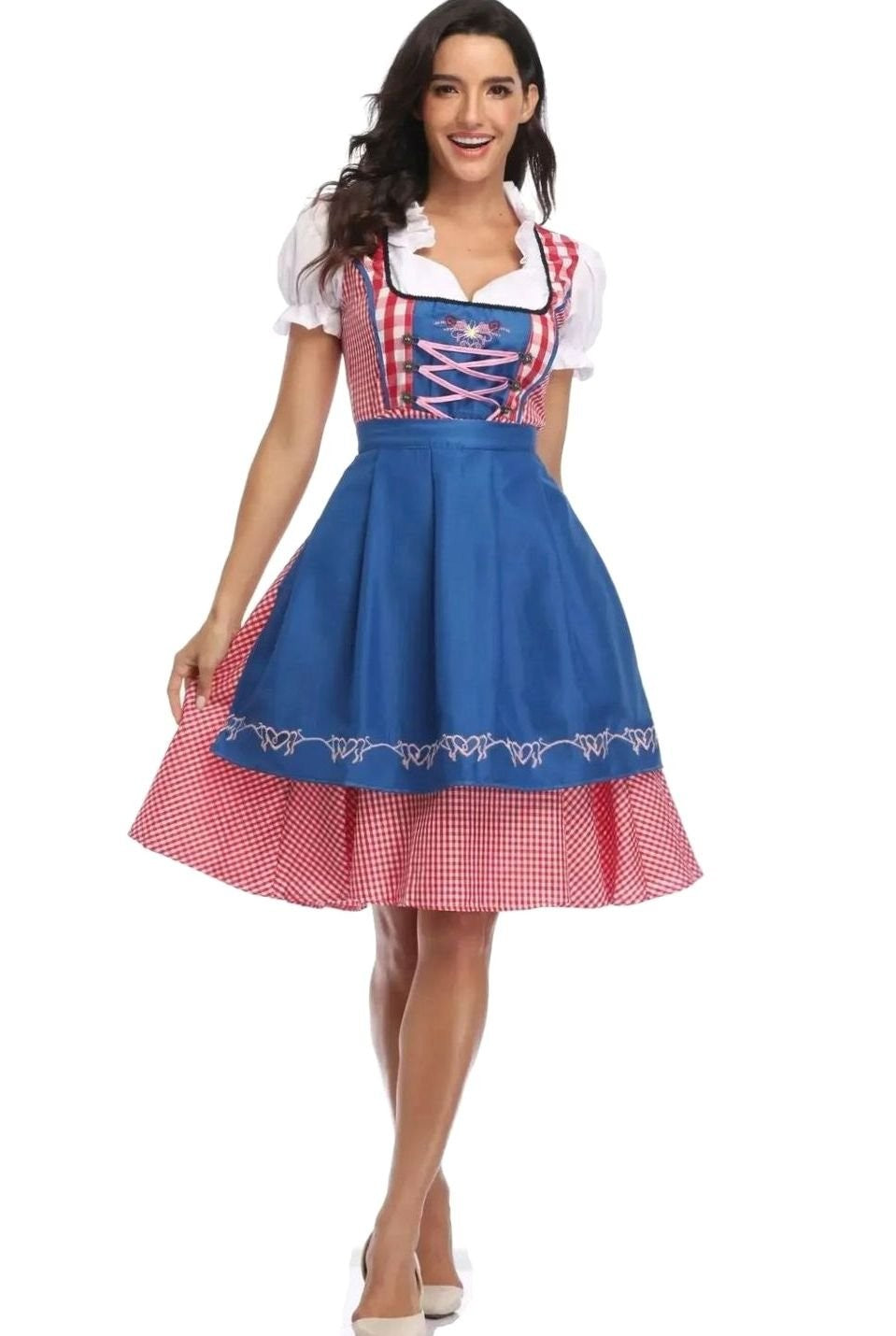 Karierte Tracht mit blauer Schürze und rosa Schnürung
